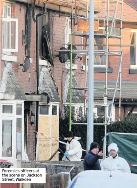  ??  ?? Forensics officers at the scene on Jackson Street, Walkden