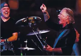  ?? RAY CHAVEZ — STAFF ARCHIVES ?? Metallica drummer Lars Ulrich, left, and lead singer James Hetfield perform with the San Francisco Symphony in a concert at Chase Center in San Francisco in September 2019.