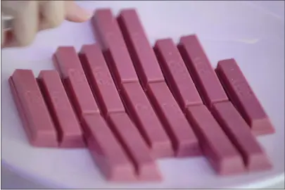  ?? AKIO KON — BLOOMBERG NEWS ?? Ruby chocolate Kitkats, produced by Nestlé, were a sensation in Asia last year. The buzz created around this naturally-pink hued and fruity-flavored chocolate — the fourth type of chocolate after milk, dark and white — has helped it reach 26markets.