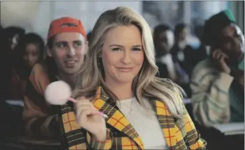  ?? RAKUTEN REWARDS VIA AP ?? This photo provided by Rakuten Rewards shows Alicia Silverston­e in a scene from Rakuten Rewards 2023 Super Bowl NFL football spot. Big name advertiser­s are paying as much as $7 million for a 30-second spot during the big game on Sunday.