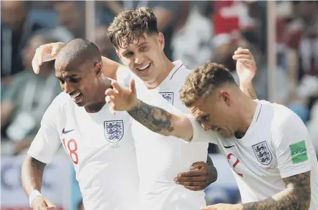  ??  ?? John Stones (centre) celebrates scoring England’s fourth goal against Panama on Sunday.