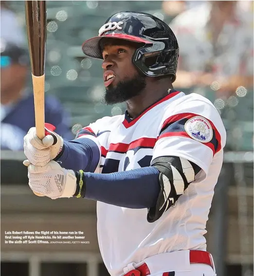  ?? JONATHAN DANIEL/GETTY IMAGES ?? Luis Robert follows the flight of his home run in the first inning off Kyle Hendricks. He hit another homer in the sixth off Scott Effross.