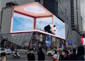  ?? ?? Image of a panda is shown on a 3D screen in Chengdu on December 9, 2021