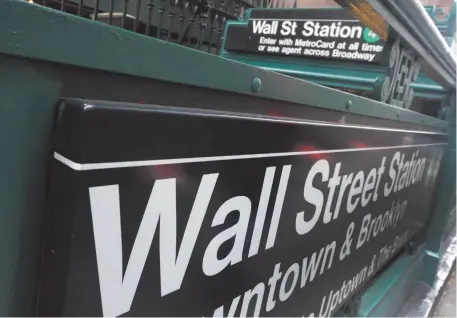  ?? AP FILE PHOTO/RICHARD DREW ?? This 2014 file photo shows the Wall Street subway stop on Broadway, in New York’s Financial District. Stocks are on the rise after their worst week in two years.