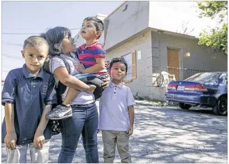  ?? RALPH BARRERA / AMERICAN-STATESMAN ?? David Rodriguez (from left), Lisbeth Rodriguez, Edgar Nunez and Alan Rodriguez arrive at their Harvard Manor apartment after school Wednesday afternoon. On Sept. 1, more than 30 families living in the complex received notice that they had less than 30...