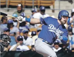  ?? Carlos Osorio Associated Press ?? THE DODGERS’ Jake Peter grounds out in the second inning of Friday’s spring-training game. An inning later, he belted a three-run homer.