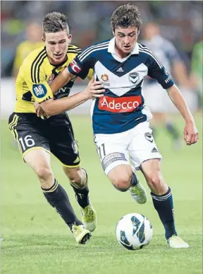  ?? Photo: GETTY IMAGES ?? Battle: Victory star Marco Rojas holds off the Phoenix’s Louis Fenton in Saturday’s encounter at AAMI Park. The Phoenix’s miserable run continued with a 2-0 loss.