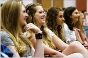  ?? JENNA EASON PHOTOS / JENNA.EASON@COXINC.COM ?? (From left) Savannah Tyler, Madison White, MaryBrigid Harding and Michala Hill laugh at a skit that the orientatio­n leaders at Georgia College performed during the university’s second freshmen orientatio­n this summer on June 15.