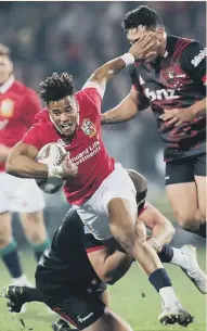  ??  ?? Lively Lions winger Anthony Watson gets tackled in Saturday’s 12-3 win over Crusaders i New Zealand.