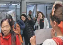  ?? ?? Chinese tourists receive a warm welcome on arrival, in Budapest, in March 2023.