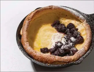  ?? GORAN KOSANOVIC FOR THE WASHINGTON POST ?? Blender Dutch Babies are the classic, Old-World puffy pancakes that can be topped with fruit and sugar for breakfast or dessert.