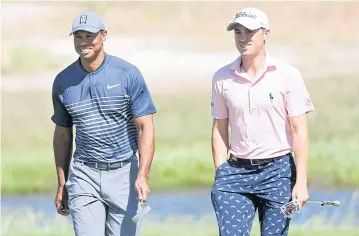  ?? AFP ?? Tiger Woods, left, and Justin Thomas during the US Open in June.