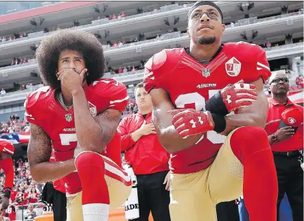  ?? THE ASSOCIATED PRESS/FILES ?? Former San Francisco 49ers safety Eric Reid, right, has filed a grievance against the NFL, alleging he remains unsigned as a result of collusion by owners. Reid joined Colin Kaepernick in kneeling during the anthem in 2016 to protest systemic oppression.
