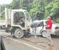  ??  ?? The car and lorry at the scene of the head-on collision at Km 2, Jalan Lagud Seberang yesterday.