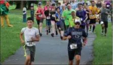  ??  ?? People run from the start line of a 5K trail run held at Riverfront Park in Pottstown. The course was along the Schuylkill River Trail.