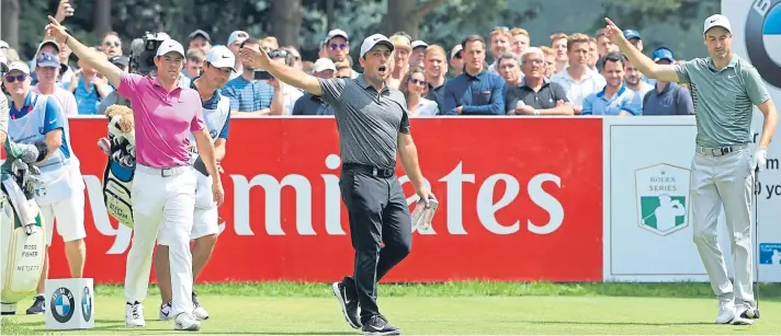  ?? Picture: Getty Images. ?? Rory McIlroy, Francesco Molinari and Ross Fisher indicate a wayward tee shot during the final round of the BMW PGA Championsh­ip.