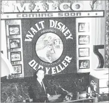  ??  ?? In the 1970s, Dick Lightman showed off a concession stand. A decade earlier, he and M. A. Lightman Jr. broke racial integratio­n barriers at their theaters, seating racially mixed audiences together.