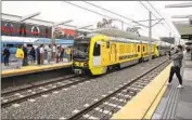  ?? Mel Melcon Los Angeles Times ?? METRO bills its proposed digital signs as a safety program. Above, a K Line train in Inglewood.