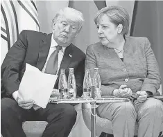  ?? POOL, GETTY IMAGES ?? President Trump and German Chancellor Angela Merkel attend a panel discussion on female entreprene­urship Saturday.