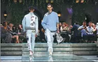  ?? LUCA BRUNO / ASSOCIATED PRESS ?? Male models display a Versace collection in Milan, Italy, on Saturday,