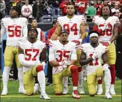  ?? AP FILE ?? 49ers Eli Harold (57), Eric Reid (35) and Marquise Goodwin (11) kneel during the national anthem before their Dec. 10 game against the host Texans.