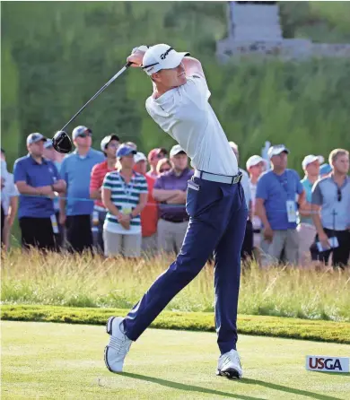  ?? RICK WOOD / MILWAUKEE JOURNAL SENTINEL ?? Mequon’s Jordan Niebrugge is the first player to tee off during the opening round of the 2017 U.S. Open at Erin Hills.