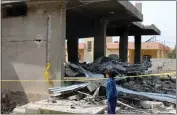  ?? PHOTO BY AFP ?? A young girl checks the damage in a building hit by an overnight Israeli airstrike near the city of Baalbeck in Lebanon's eastern Bekaa Valley on Saturday.