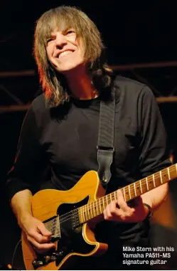  ??  ?? Mike Stern with his Yamaha PA511-MS signature guitar