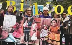  ?? Guardian News & Media Ltd ?? Residents from the central Queensland town of Biloela stand outside the court in Melbourne to voice their support for an asylum-seeker family facing forced removal to Sri Lanka.