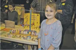  ?? COURTESY PHOTO ?? Rappahanno­ck Elementary School student Sarah Spear offers an array of her colorful handmade jewelry for sale at Market Day.