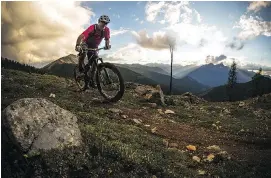  ??  ?? Biking enthusiast­s get their fill of thrills on Hopeful Trail.