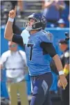  ?? AP PHOTO/MARK ZALESKI ?? Tennessee Titans quarterbac­k Ryan Tannehill celebrates after running for a touchdown against the Las Vegas Raiders during the first half of Sunday’s game in Nashville. The Titans won to avoid an 0-3 start.