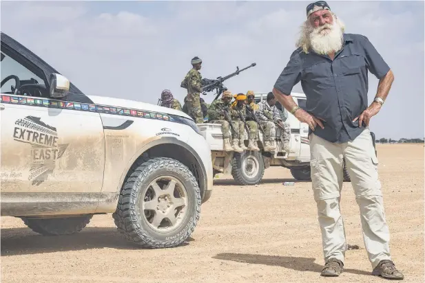  ??  ?? DANGER AHEAD Explorer Kingsley Holgate on the road he and his team travelled from Somaliland into Puntland to reach the easternmos­t point of Africa, along with their armed bodyguards.