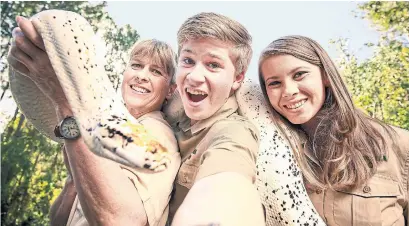  ?? JASON ELIAS ANIMAL PLANET/TRIBUNE NEWS SERVICE ?? From left, Terri, Robert and Bindi Irwin star in Crikey! It's the Irwins, a wildlife series on Animal Planet.