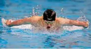  ?? [PHOTO BY SARAH PHIPPS, THE OKLAHOMAN] ?? Norman North’s Aiden Hayes swims in the 100-yard butterfly Saturday.