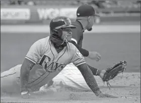  ?? Associated Press ?? Tag: Chicago White Sox first baseman Jose Abreu, right, tags first base as Tampa Bay Rays Mallex Smith, left, tries to slide in during the fifth inning of their game in Chicago Tuesday.