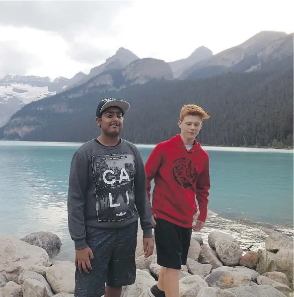  ??  ?? Shakir Salaam, left, and his friend and ‘brother’ Jacob Borchardt at Lake Louise in 2014. Salaam, who was killed when he was pinned by a tree in Surrey during Friday’s windstorm, grew up with Borchardt and for a time lived with him and his mom, Lisa...