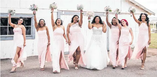  ??  ?? Destiny Gonzaque Washington and her bridesmaid­s pose for a photo at her April wedding at The Manor at Coffee Creek in Edmond.