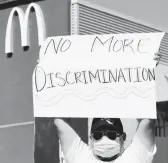  ?? FREDERIC J. BROWN/GETTY-AFP ?? A McDonald’s employee protests April 9 in Los Angeles. McDonald’s says it will start anti-harassment training worldwide in 2022.