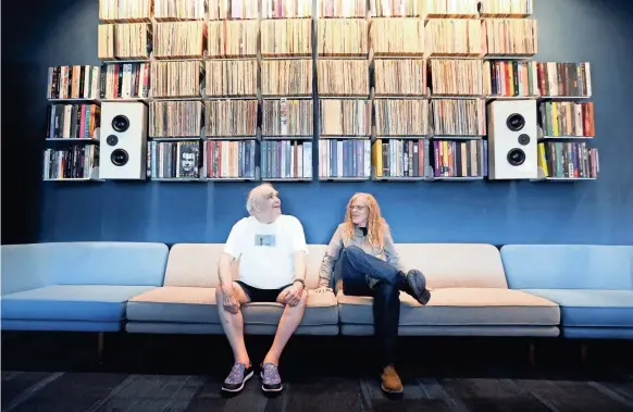  ?? JOE RONDONE/THE COMMERCIAL APPEAL ?? Former Ardent publicist and DJ John King, left, sits with archivist Jim Cole inside the Memphis Listening Lab, a new public space in the Crosstown Building, that allows patrons, researcher­s and the public to access his massive library of recordings.