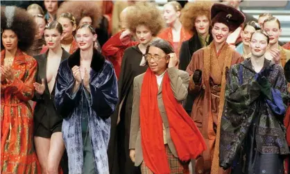  ?? Photograph: Joel Saget/AFP/Getty Images ?? The designer Kenzo, centre, takes to the catwalk after showing a ready-to-wear autumn/winter collection in Paris in the late 1990s.