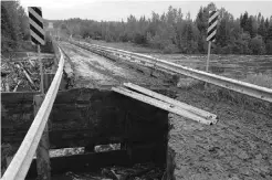  ?? SUPPLIED ?? The north side of the Firebag River Bridge, about 100 kilometres north of Fort McMurray, was washed out on Saturday.