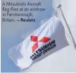  ?? — Reuters ?? A Mitsubishi Aircraft flag flies at an airshow in Farnboroug­h, Britain.