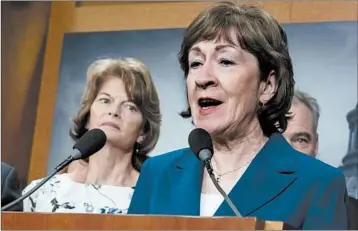  ?? J. SCOTT APPLEWHITE/AP ?? Sen. Lisa Murkowski, R-Alaska, left, listens as Sen. Susan Collins, R-Maine, talks to reporters. Pro-abortion rights groups plan to lobby the two Republican­s over the Supreme Court nominee because of their support on the issue.