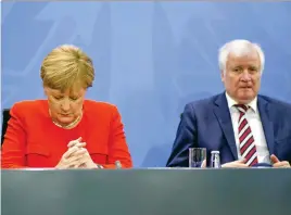  ?? (Markus Schreiber/AP/SIPA) ?? German Chancellor Angela Merkel and Interior Minister Horst Seehofer during a press conference at the chanceller­y in Berlin.