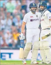  ?? AFP ?? Rohit Sharma (L) and Cheteshwar Pujara stitched together a 153run stand for the second wicket on Day 3 of the fourth Test at the Oval on Saturday.