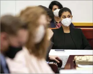  ?? KELSEY KREMER — VIA THE ASSOCIATED PRESS ?? Des Moines Register reporter Andrea Sahouri listens Monday to opening statements in her trial in Iowa City, Iowa. She is charged with failure to disperse and interferen­ce with official acts while reporting on a protest last summer in Des Moines.