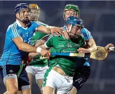  ??  ?? DRIVING FORCE: Limerick’s David Reidy is tackled by Conal Keaney (left) and Fergal Whitely of Dublin