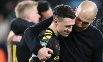  ??  ?? Pep Guardiola (right) celebrates with Phil Foden after Manchester City’s Carabao Cup final win against Aston Villa in March. Photograph: Alex Livesey/Danehouse/Getty Images