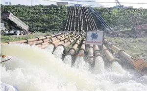  ??  ?? Irrigation officials have installed more pipes to speed up drainage from Kaeng Krachan dam.